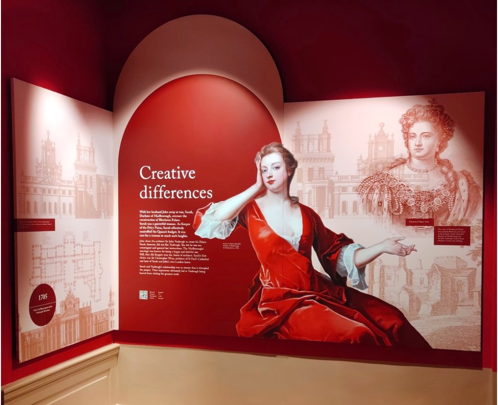 View of graphic panel at Blenheim Palace showing text, drawings of palace and images of Queen Anne and the Duchess of Marlborough. 